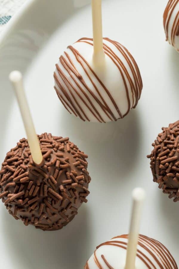 Overhead image of cake pops on a white plate