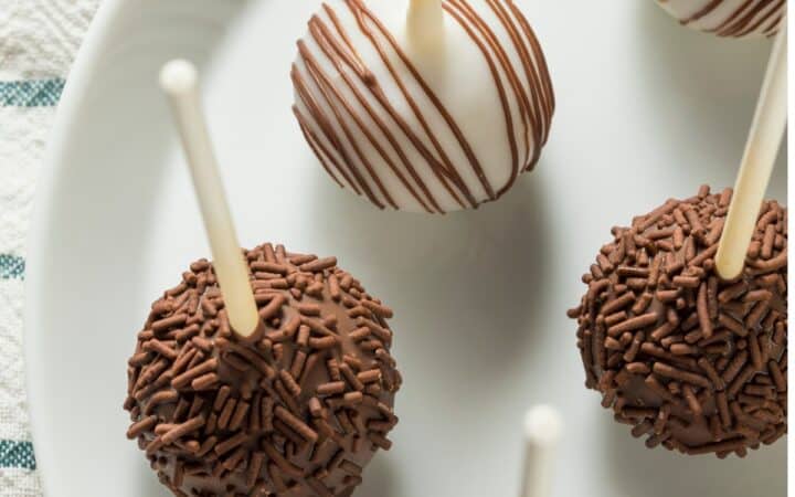 Overhead image of cake pops on a white plate