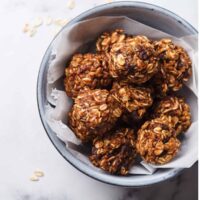 Overhead image of chocolate balls in a bowl with parchment paper