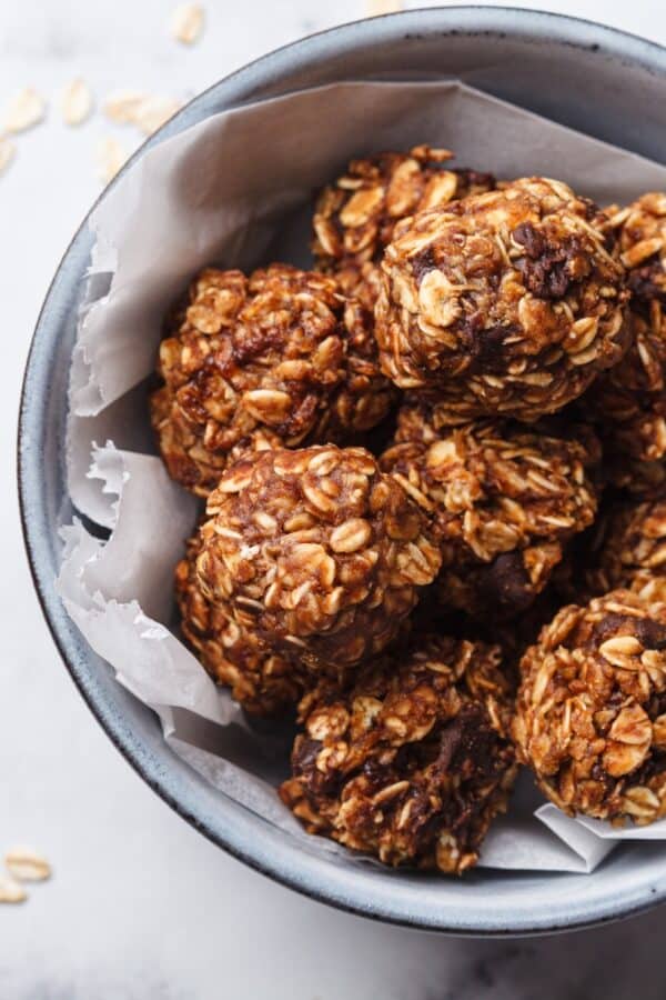 Overhead image of chocolate balls in a bowl with parchment paper