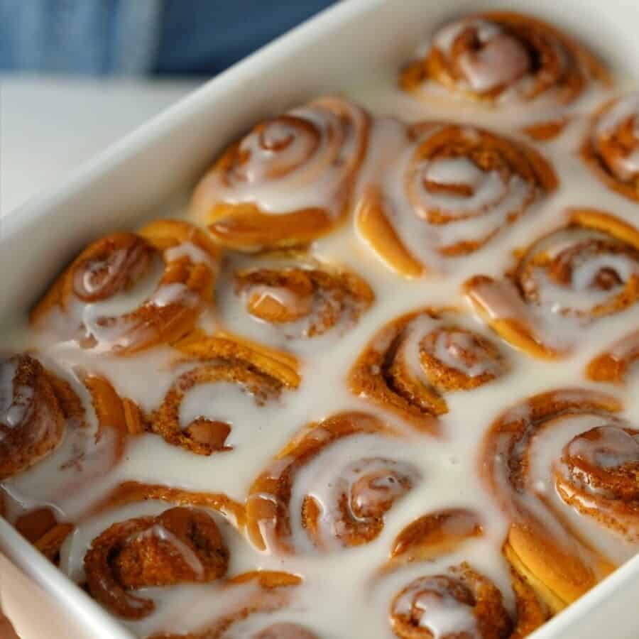 Close up image of Orange Rolls in a baking pan