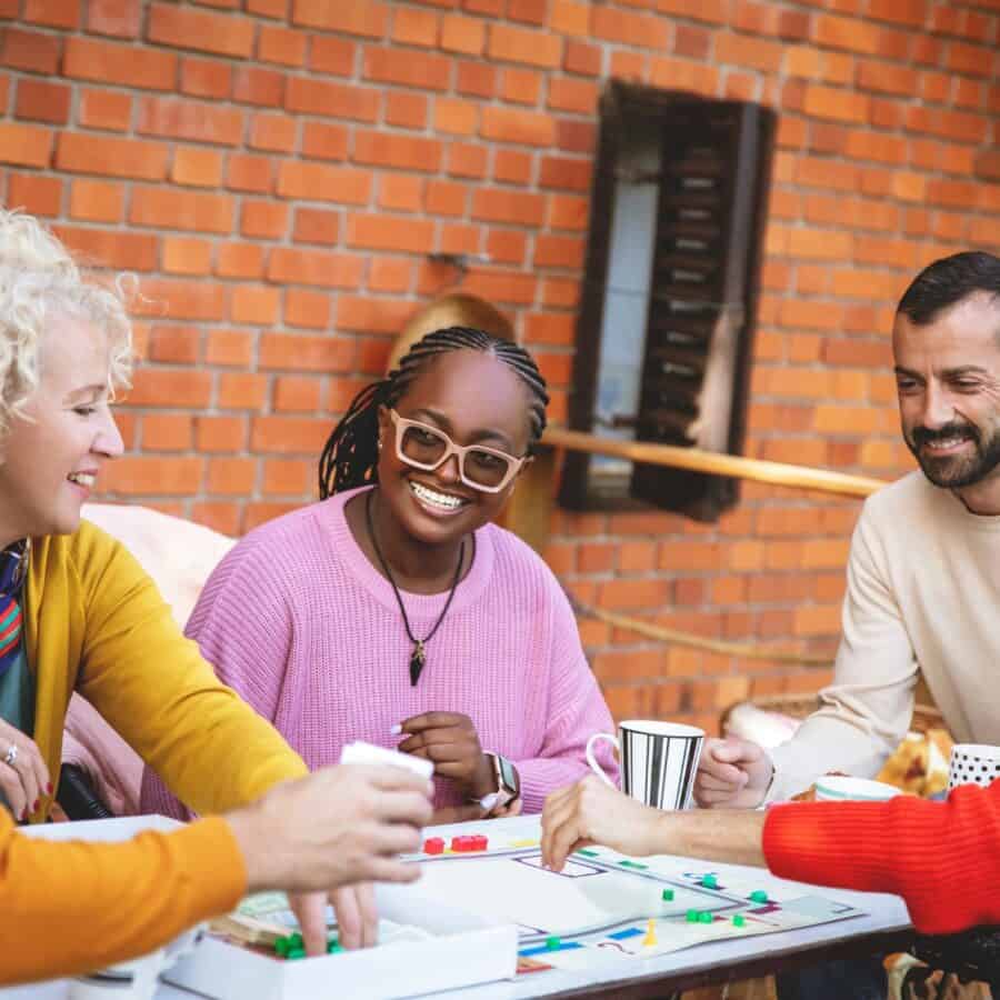 People sitting at a table playing board games