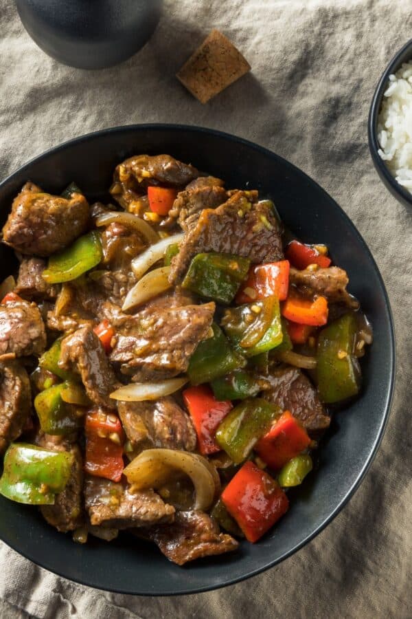 Overhead image of Pepper Steak in a bowl with rice on the side