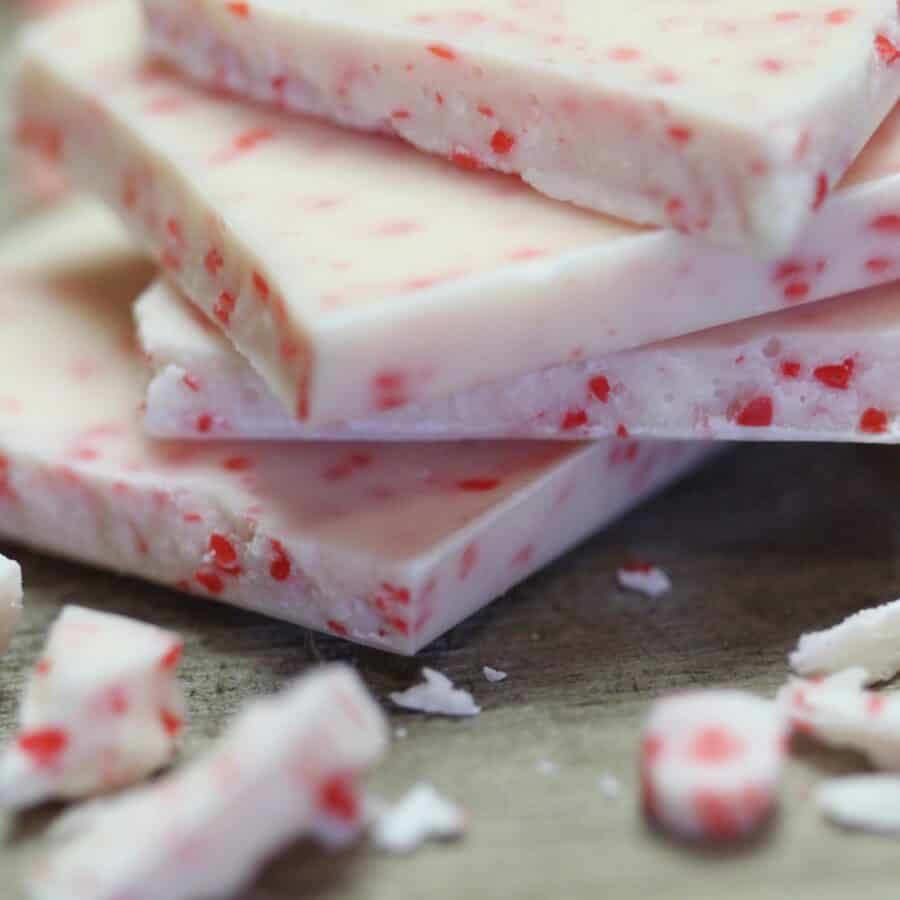 Close up image of several pieces of peppermint fudge stacked on top of eachother