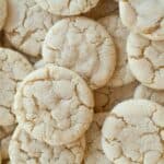A close up image of a bunch of soft sugar cookies stacked on top of eachother - 8