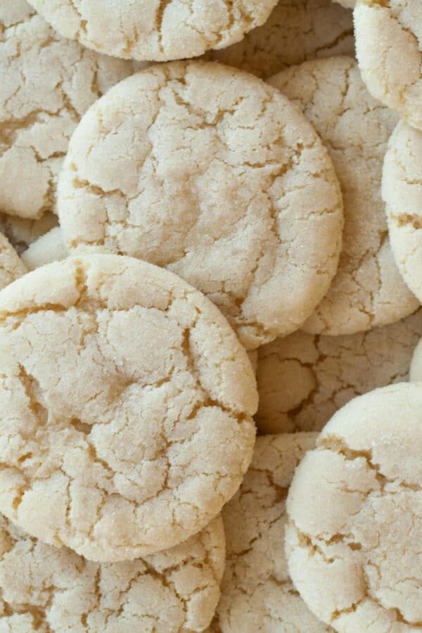 A close up image of a bunch of soft sugar cookies stacked on top of eachother