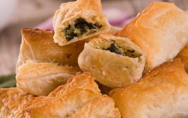 Spinach Puffs stacked on a plate