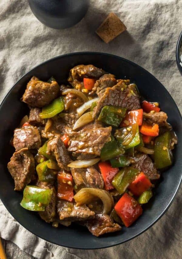 Overhead image of Pepper Steak in a bowl with rice on the side
