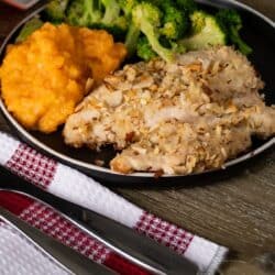 Almond chicken Almond Crusted Chicken on a plate with side dishes