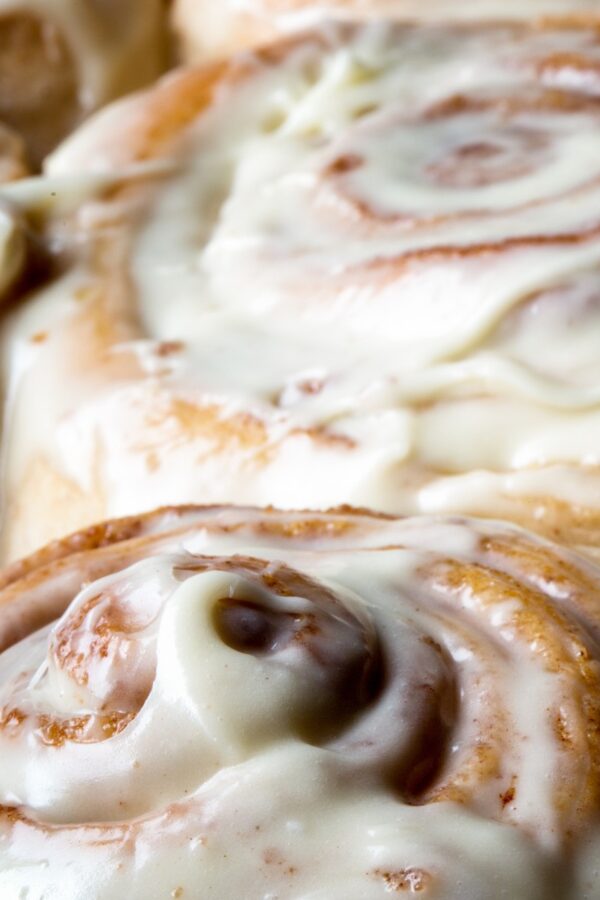 close up image of frosted protein cinnamon rolls