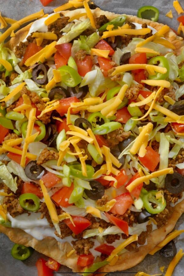 Overhead image of Taco Pizza on parchment paper