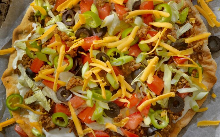 Overhead image of Taco Pizza on parchment paper