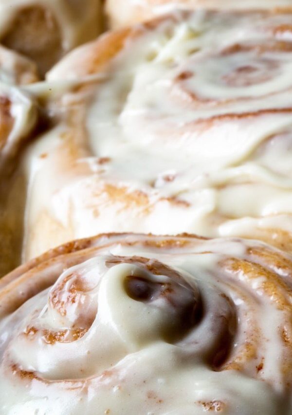 close up image of frosted protein cinnamon rolls