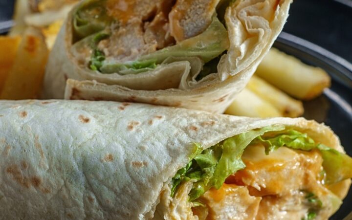 Close up image of a Buffalo Chicken Wrap cut in half - 5