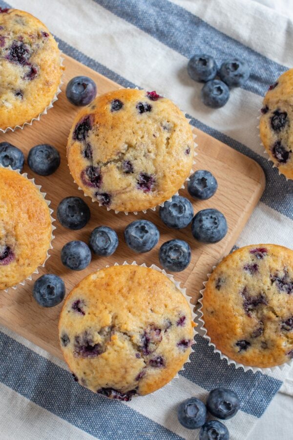 Overhead image of cottage cheese muffins with blueberries ona cutting board