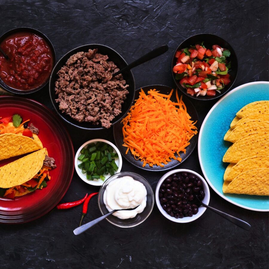 Ingredients needed to make a taco bar in individual containers
