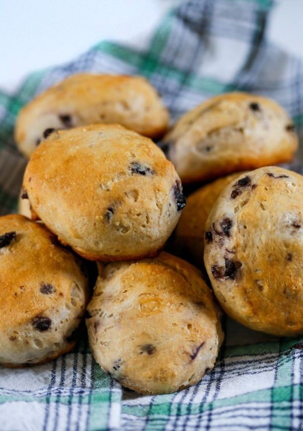 Blueberry Biscuits on a plaid cloth stacked in a pile