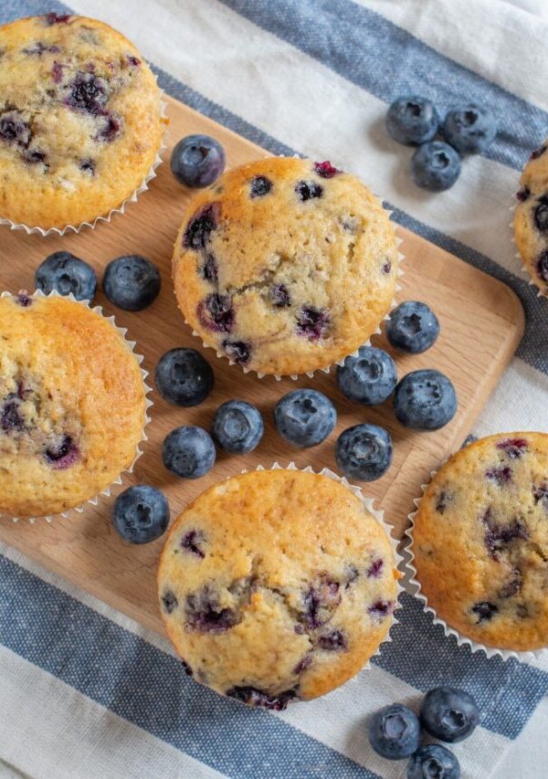 Overhead image of cottage cheese muffins with blueberries ona cutting board