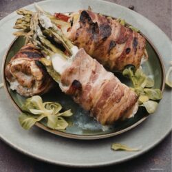 asaparagus stuffed chicken thighs on a plate