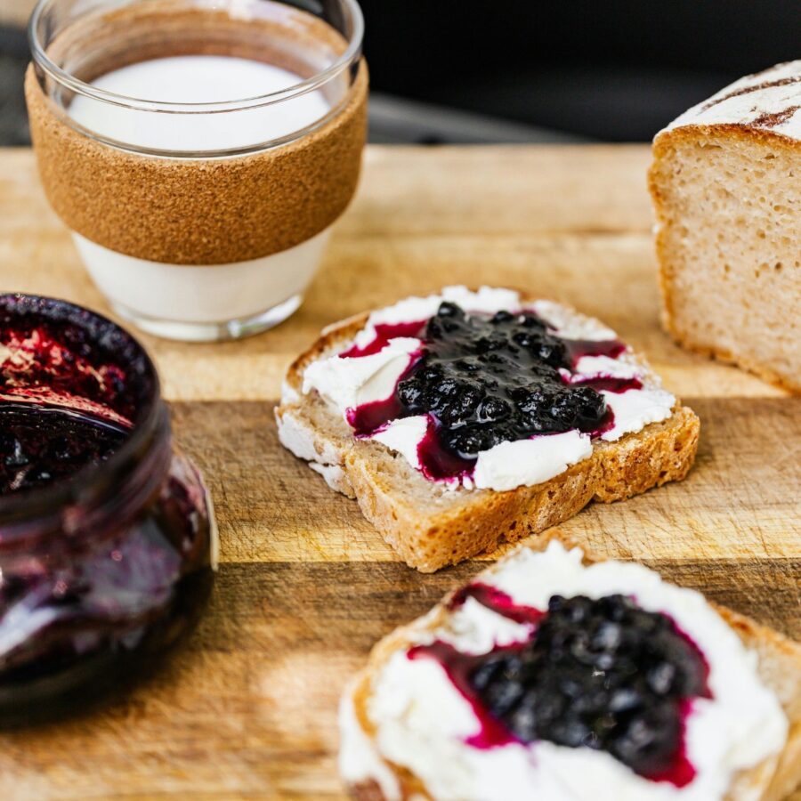 Blueberry compote in a jar and spread over toast