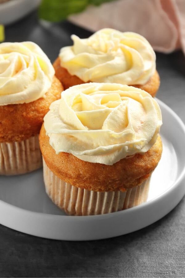 Close up image of three carrot muffins on a plate