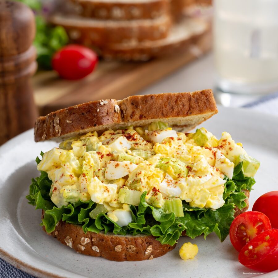 Egg Salad Sandwich on a plate with tomatoes