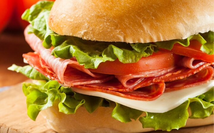 Close up image of an Italian Sub Sandwich on a cutting board