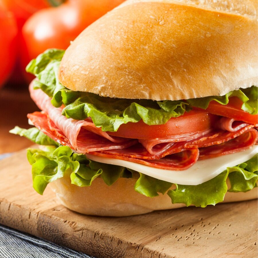 Close up image of an Italian Sub Sandwich on a cutting board
