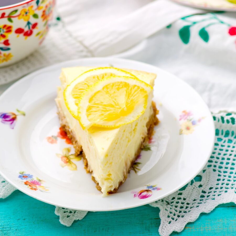 Close up image of lemon cheesecake on a decorative plate 