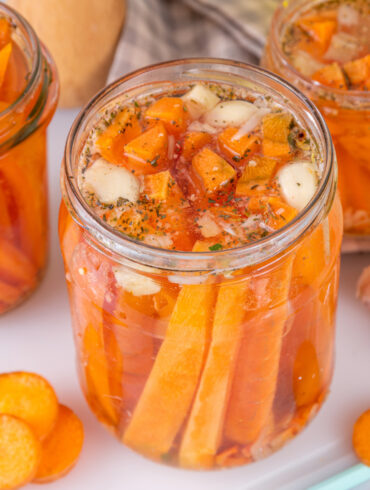Pickled carrots in glass jars