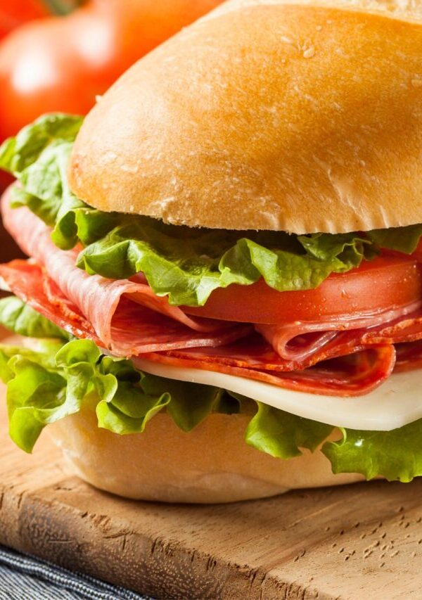 Close up image of an Italian Sub Sandwich on a cutting board