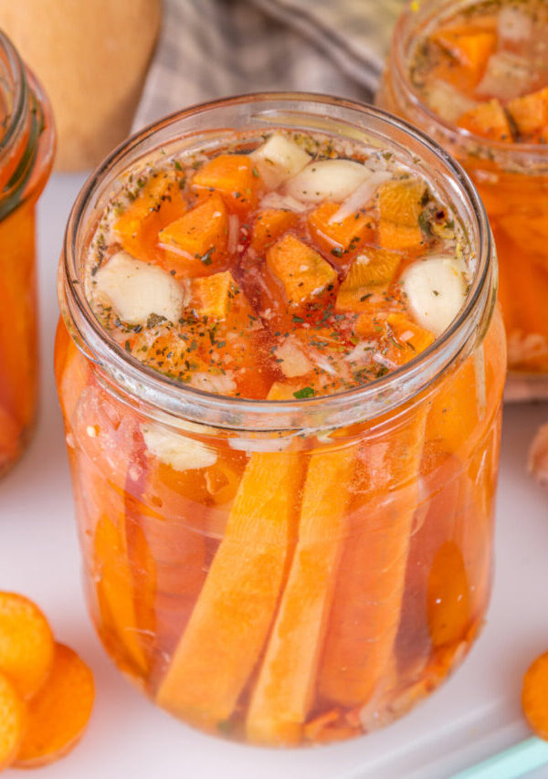 Pickled carrots in glass jars