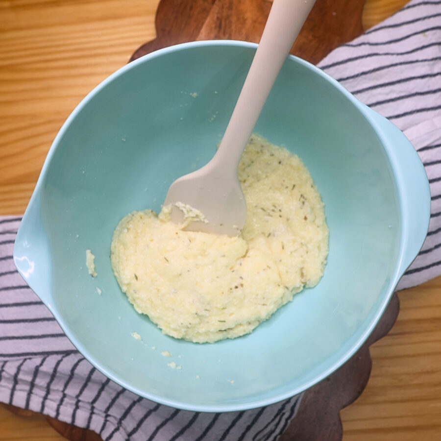 Parmesan cheese, egg whites, and Italian seasoning combined in a bowl