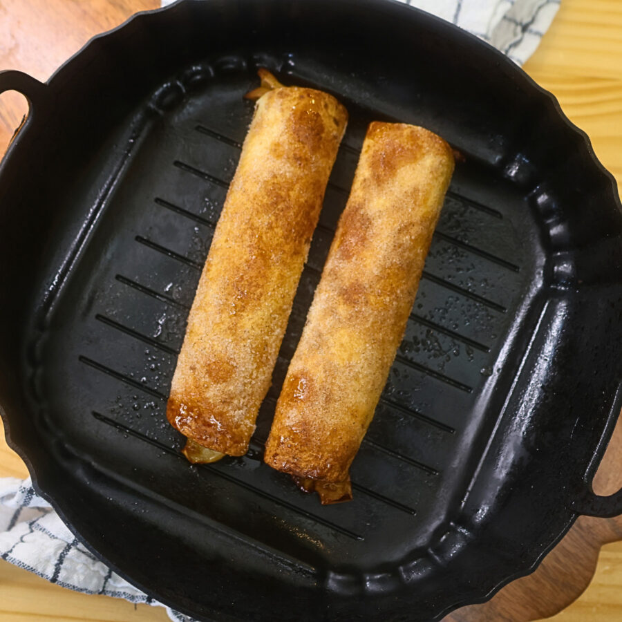 Air Fryer Apple Pie Taquitos in an air fryer basket