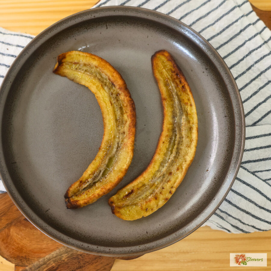 Two pieces of air fryer caramelized bananas on a plate