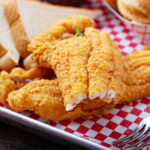Close up image of air fryer catfish with a bite taken out of it