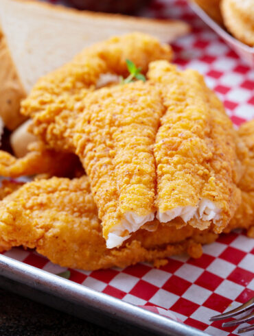 Close up image of air fryer catfish with a bite taken out of it