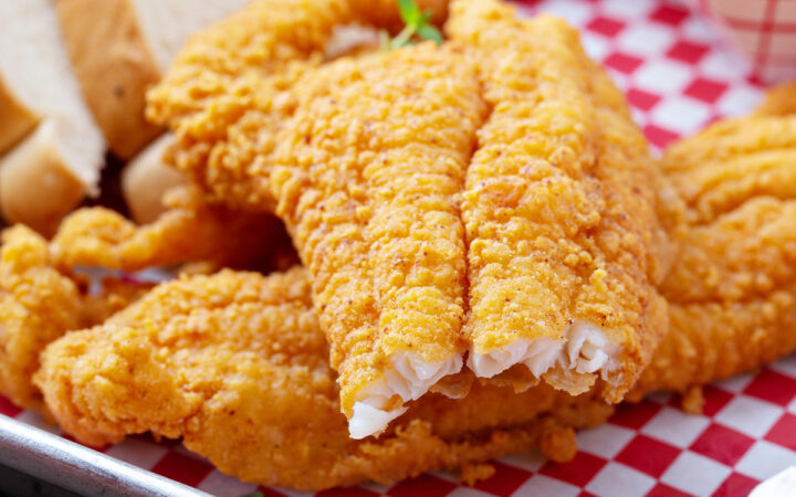 Close up image of air fryer catfish with a bite taken out of it