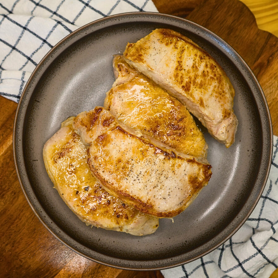 Seared pork chops on a plate