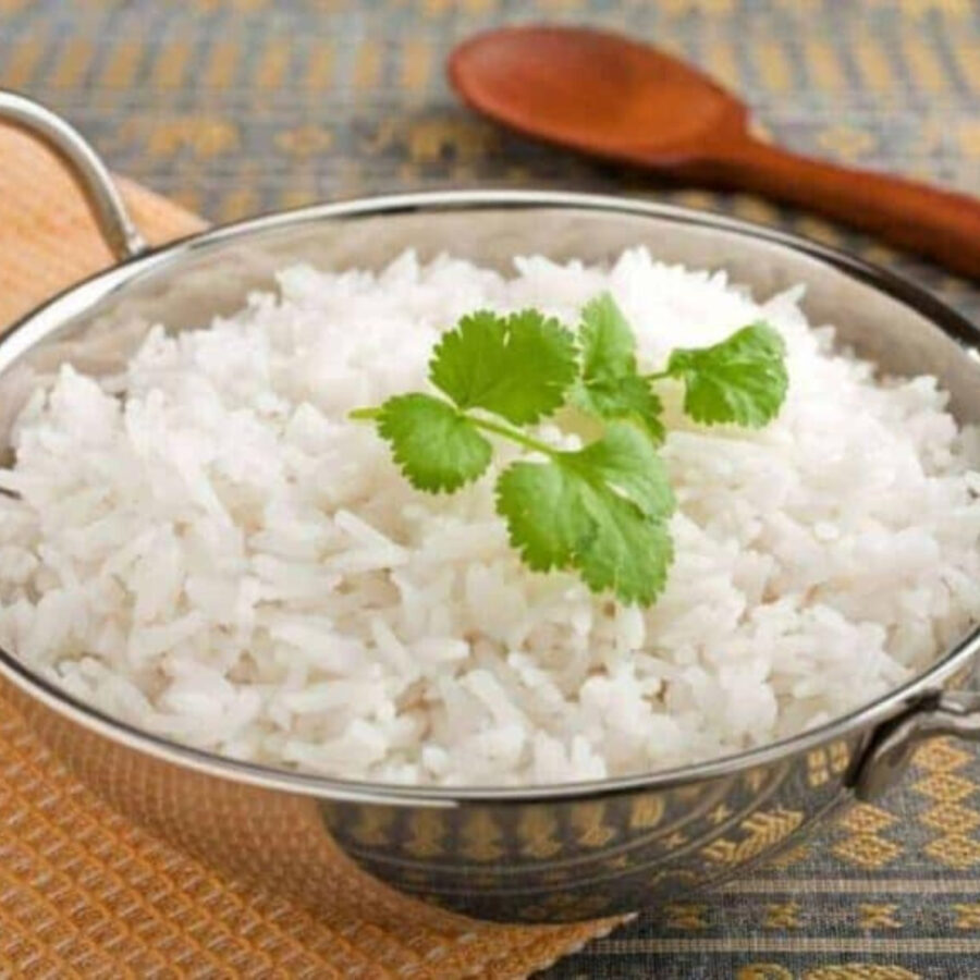 Basmati Rice in a metal serving dish with cilantro garnish