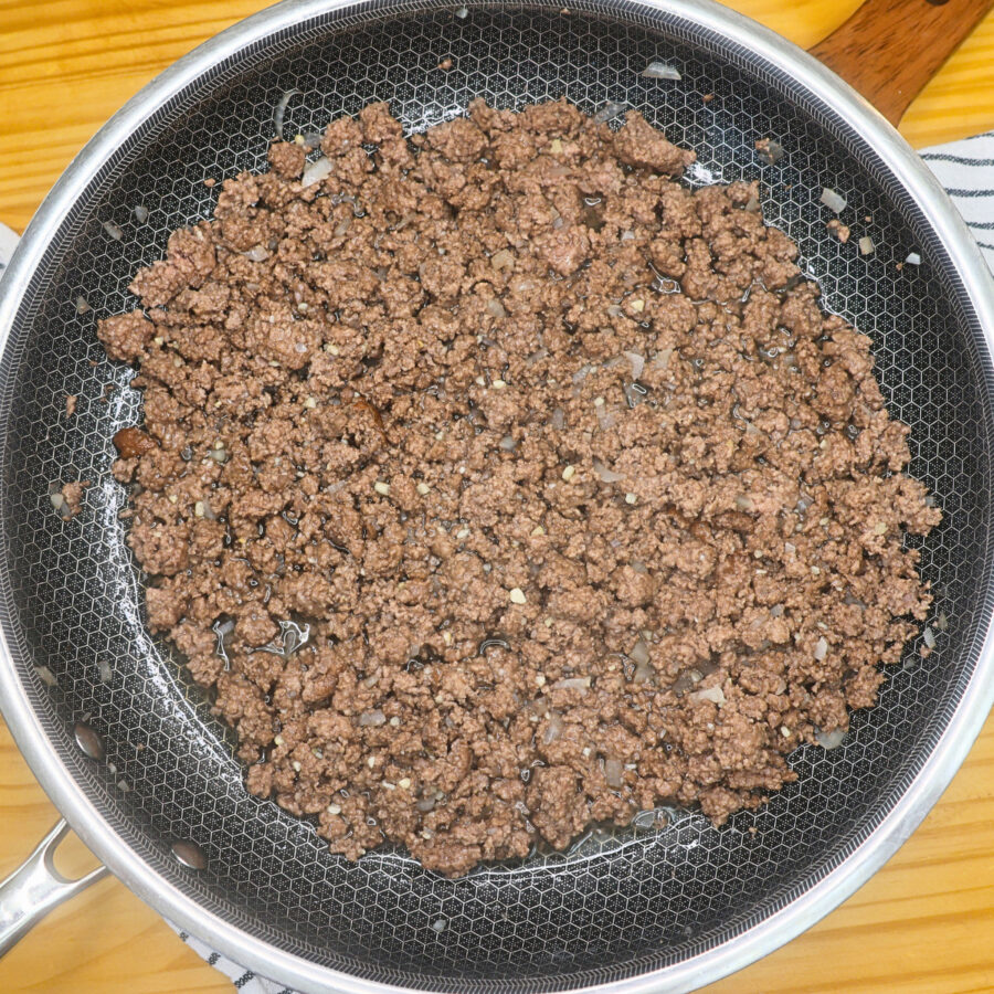 Ground beef and onion cooked in a skillet