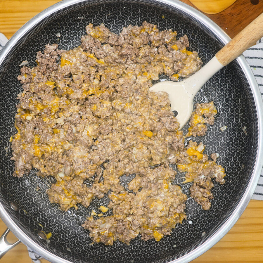 Cooked ground beef and onion with cream cheese and shredded cheese mixed in
