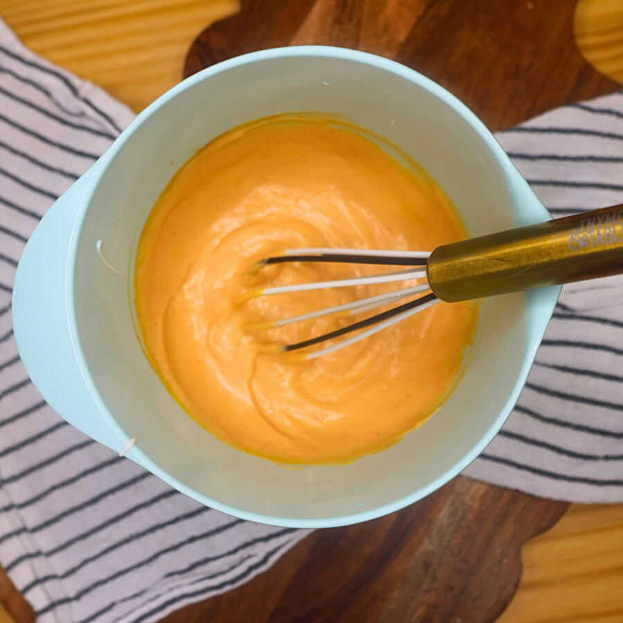 Copycat Big Mac Sauce in a blue bowl with a whisk