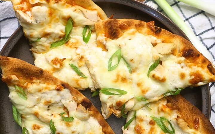 Four slices of Buffalo Chicken Flatbread Pizza on a plate