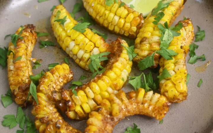 Close up image of Cajun Butter Corn Ribs on a plate