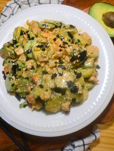Overhead image of California Roll Cucumber Salad in a white bowl