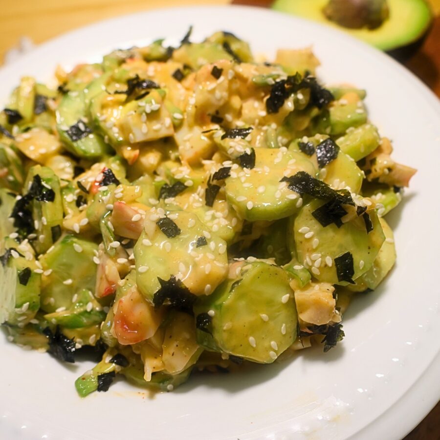 Close up image of California Roll Cucumber Salad in a white bowl