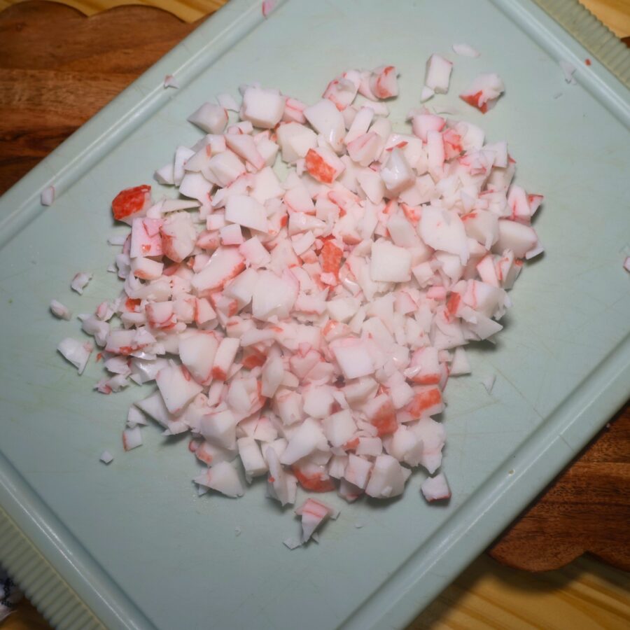 Chopped imitation crab on a cutting board