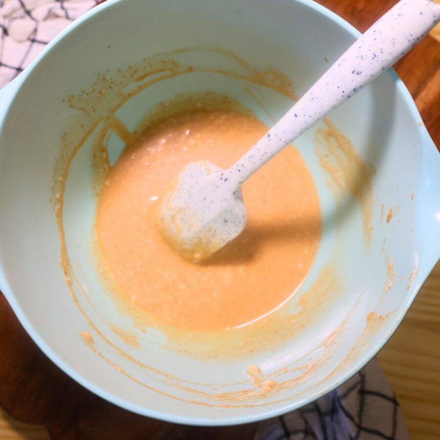 Sauce for California Roll Cucumber Salad in a blue bowl