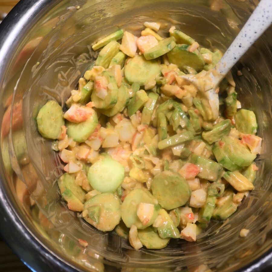 California Roll Cucumber Salad with homemade dressing in a metal bowl